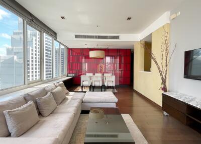 Modern living room with large windows and city view