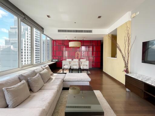 Modern living room with large windows and city view