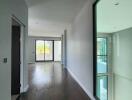 Modern hallway with wooden flooring and large windows