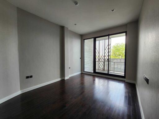 Spacious empty living room with dark hardwood floors