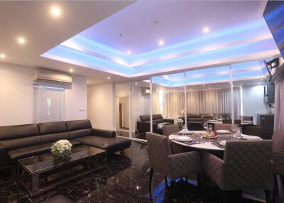 Modern living and dining area with ambient lighting