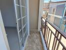 Small balcony with railing and tiled floor