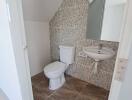 Small bathroom with tiled walls