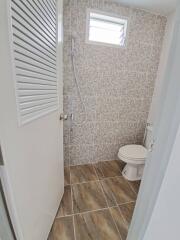 Modern bathroom with tiled walls and flooring