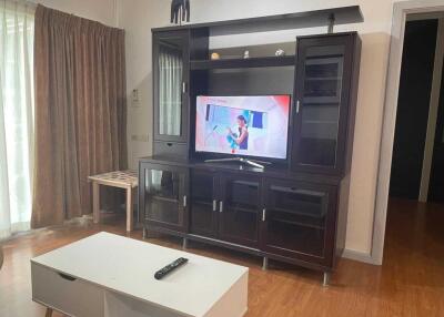 Living room with entertainment center and coffee table