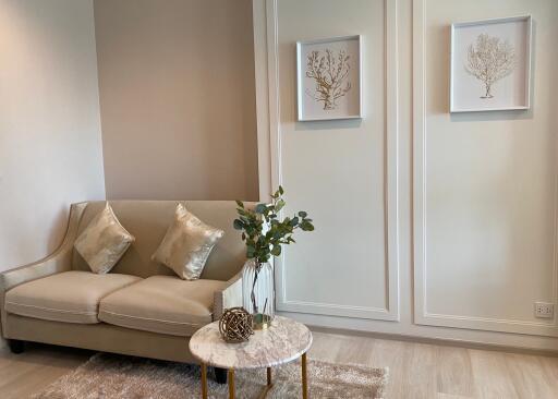 Modern living room with beige sofa and decorative elements