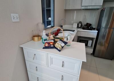 Modern kitchen with white cabinetry and appliances