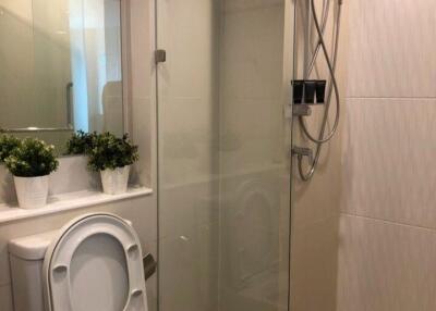 Modern bathroom with glass shower and toilet