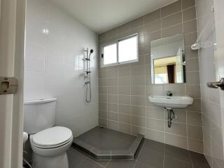 Modern bathroom with shower, toilet, and sink