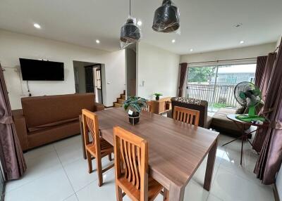 Modern living room and dining area with furniture