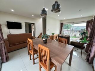 Modern living room and dining area with furniture