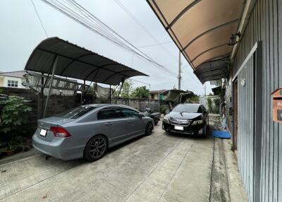 Outdoor garage with parked cars