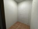 Empty storage room with tiled floor