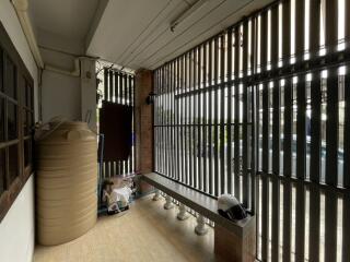 Covered outdoor space with barred enclosure