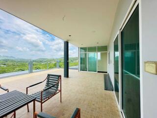 Spacious balcony with outdoor furniture and scenic views