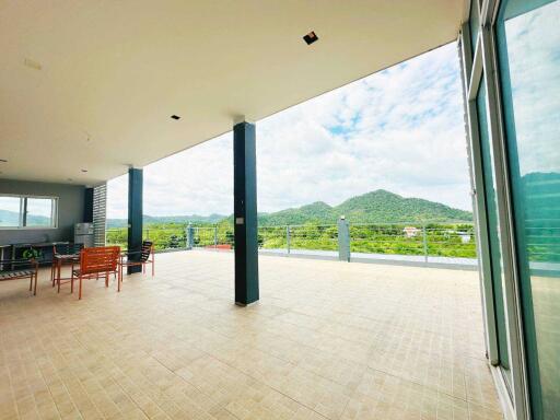 Spacious balcony with scenic mountain view