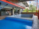 Covered outdoor area with tiled pool