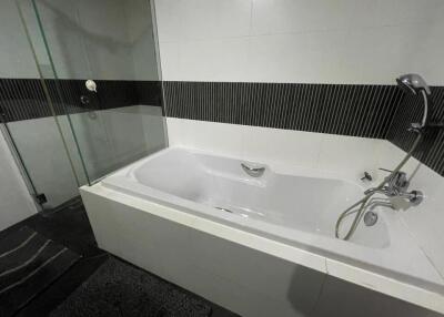 Modern bathroom with a bathtub and shower