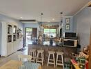 Modern kitchen with breakfast bar and adjacent dining area