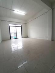 Spacious empty living room with large window