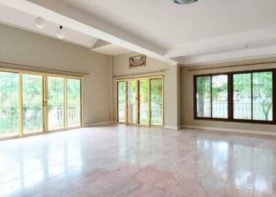 Spacious living room with large windows and natural light