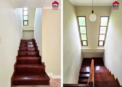 Staircase area with wooden steps and windows