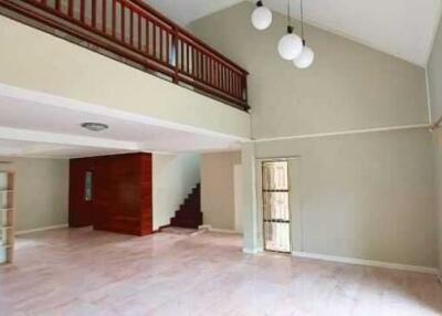 Spacious living area with high ceilings and plenty of natural light