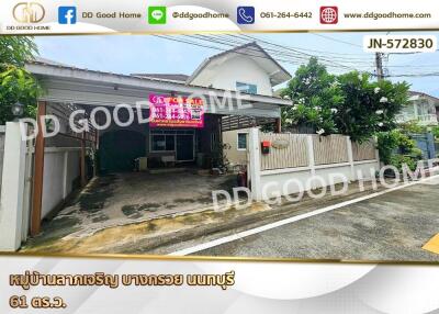 Exterior view of a house with a garage and gated entrance