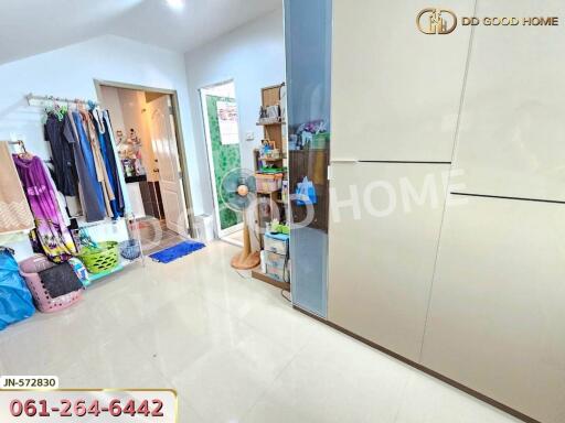 Spacious bedroom with open wardrobe and ensuite bathroom