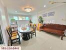 Spacious living room with dining area and natural light