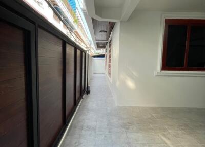 Covered corridor with tiled floor