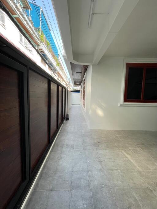 Covered corridor with tiled floor