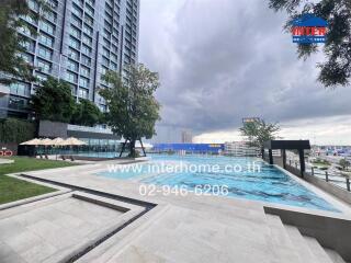 Apartment complex with swimming pool and city view