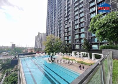 Outdoor view of a modern building with a swimming pool