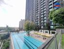 Outdoor view of a modern building with a swimming pool