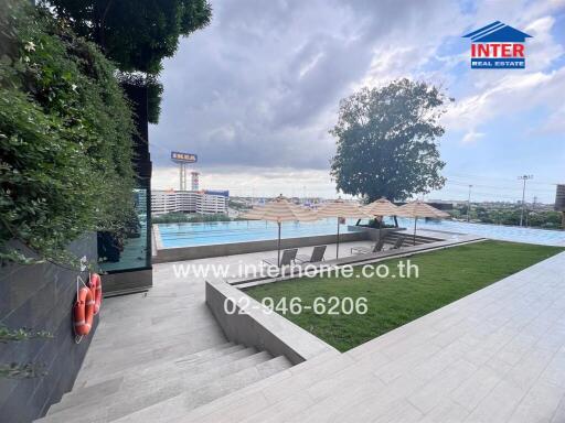 outdoor pool area with view of the city