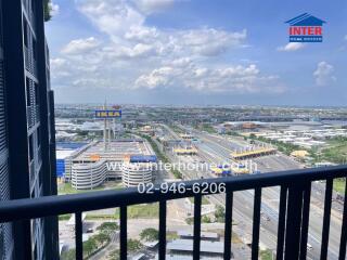 Balcony view overlooking a busy highway and IKEA store