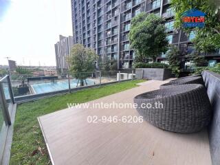 Modern condominium with swimming pool and outdoor seating