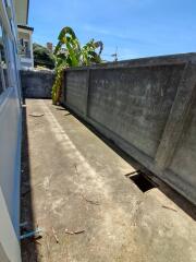 Concrete outdoor space with surrounding wall