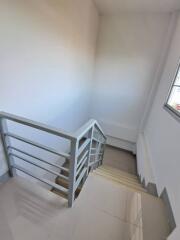 Modern staircase with metal railing