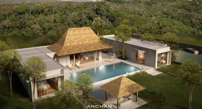 Aerial view of a luxurious villa with a pool and lush greenery