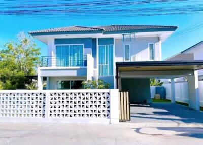 Front view of a modern two-story house with garage