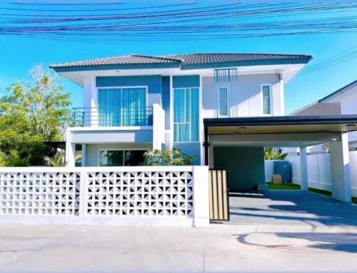 Front view of a modern two-story house with garage