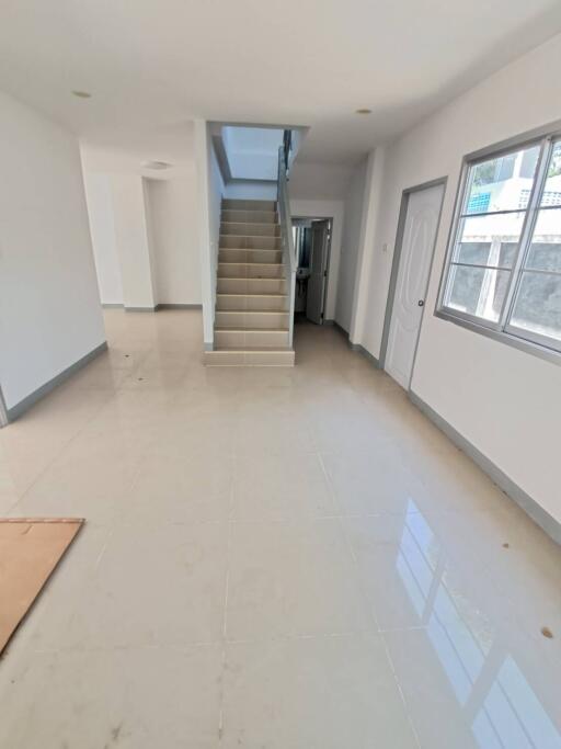 Spacious living area with staircase