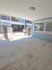 Garage space with tiled flooring and open access