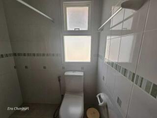 Small bathroom with window and toilet