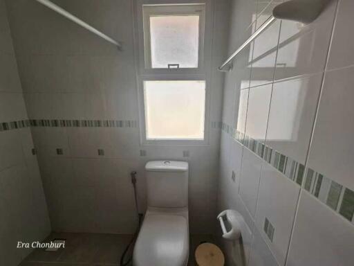 Small bathroom with window and toilet