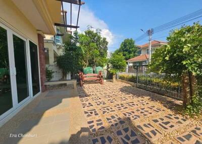 Well-maintained garden with seating area and patio