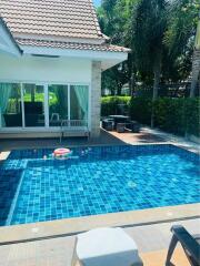 Outdoor patio area with pool