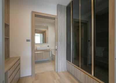 Modern bedroom with ensuite bathroom and wooden furnishings